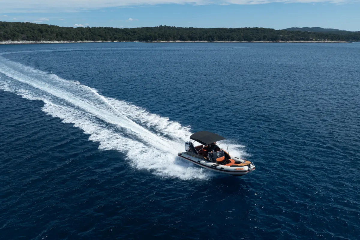 Private boat exploring the coastline around Mali Lošinj.